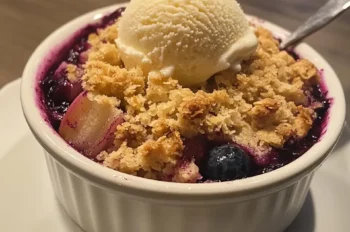 Freshly sliced rhubarb and blueberries in a bowl ready for crumble