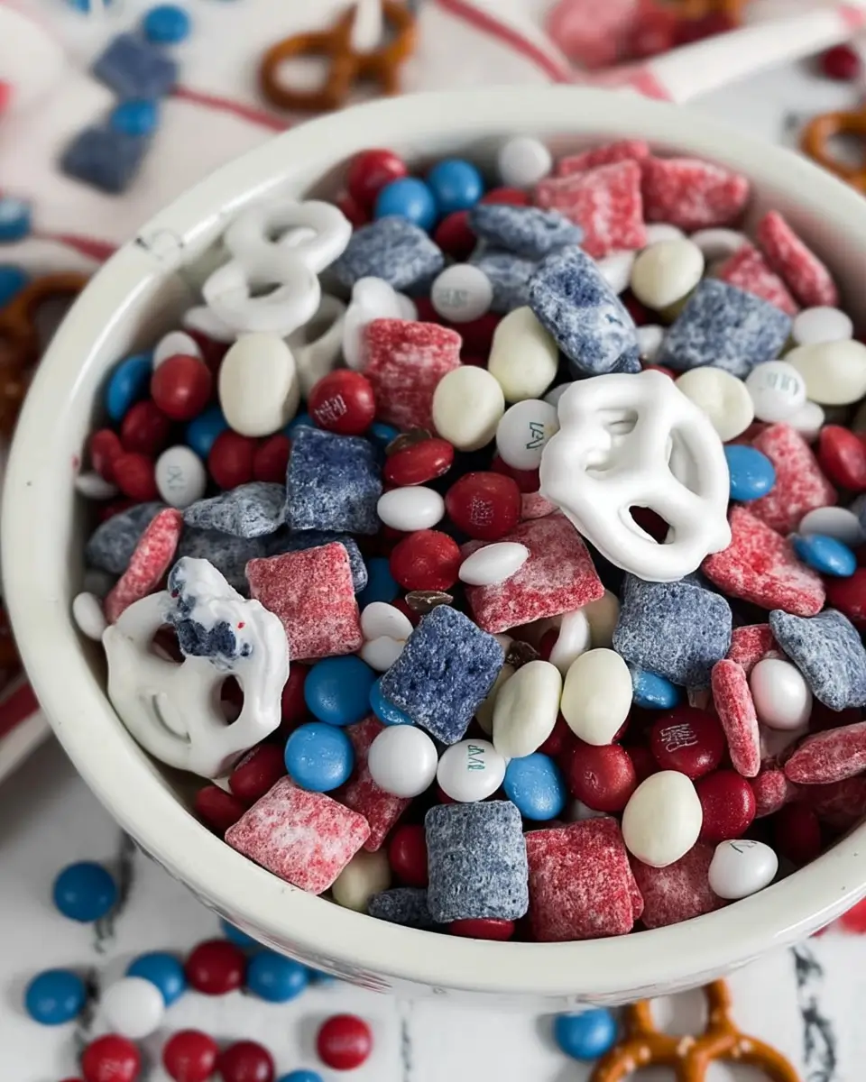 Red, white, and blue snack mix in bowl